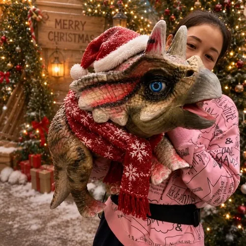 A festive dinosaur puppet dressed in a Santa hat and scarf