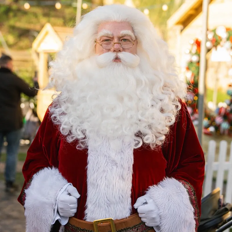 Visitors browsing festive stalls at Tonbridge Christmas Fest