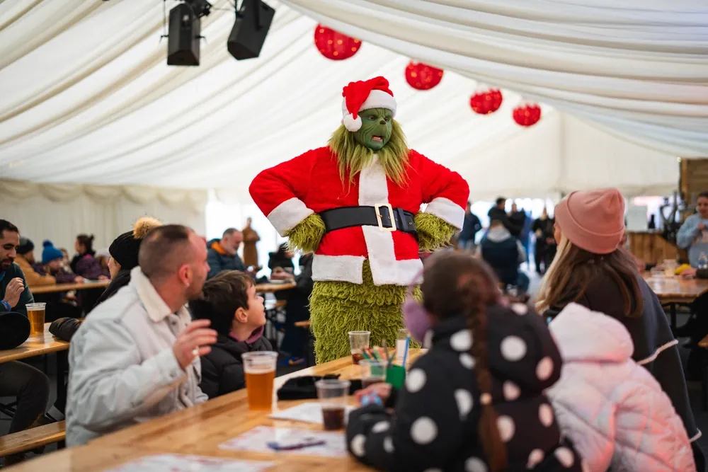 Families enjoying Lunch with the Grinch